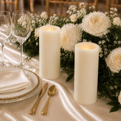 Elegant wedding table setting with white flowers, candles, and gold accents