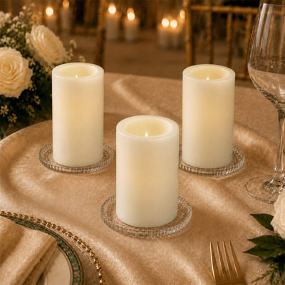 Elegant LED flameless candles on a gold wedding table setting