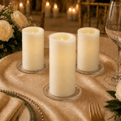 Elegant LED pillar candles on a gold wedding table centerpiece
