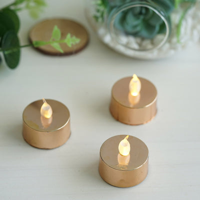 Battery-operated LED tea light candles in gold holders.