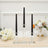 Black LED taper candles in clear glass holders with white floral decor