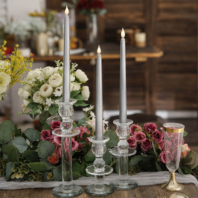 Elegant wedding table centerpiece with silver candles and floral arrangements