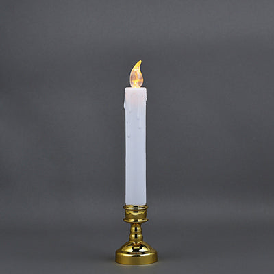 Gold candlestick with a white candle and flickering flame.