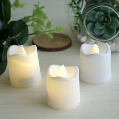 Set of three white LED candles with warm glow, perfect for ambiance.