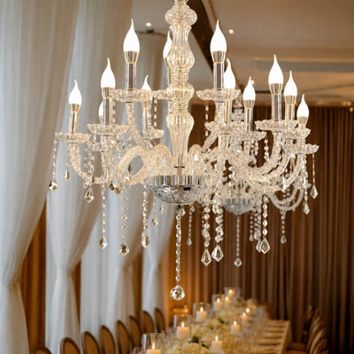 Elegant crystal chandelier with candle-style lights over a luxury dining table
