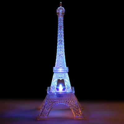 Illuminated crystal Eiffel Tower replica with colorful LED lights.
