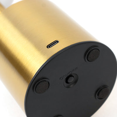 Gold and black lamp base with power switch and charging port