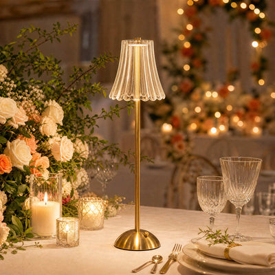 Elegant gold table lamp on a romantic floral dinner table setting