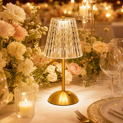 Gold LED table lamp on elegant floral wedding dinner table setting
