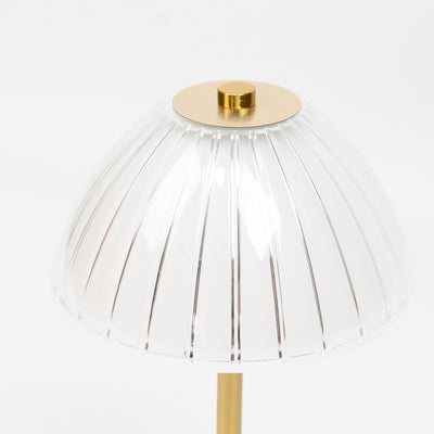 Gold and clear acrylic dome table lamp shade close-up