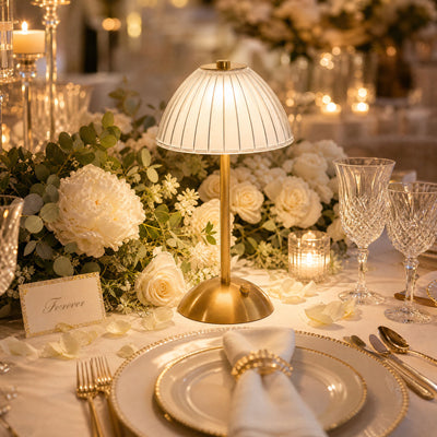 Elegant romantic wedding table centerpiece with candlelight and white flowers