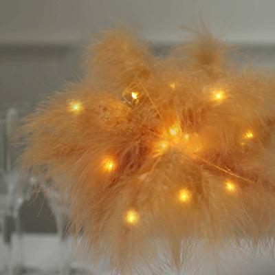 Decorative pampas grass with warm LED lights for home decor.