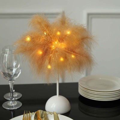 Feather light decoration with warm lights on a table setting