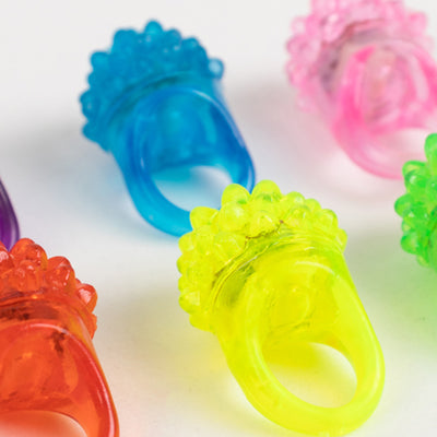 Colorful textured rubber rings in neon hues.
