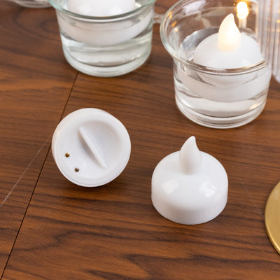 White LED candle with removable top and flame-shaped tip.