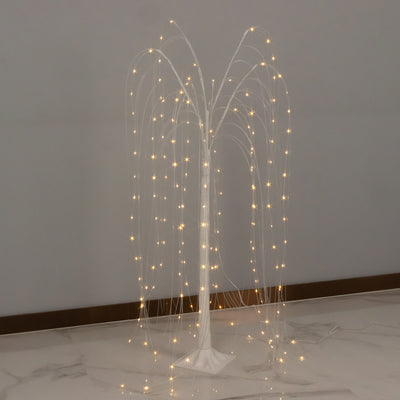 Decorative LED light tree with cascading branches illuminated at night