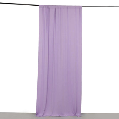 Purple sheer fabric drape hanging against a plain background.