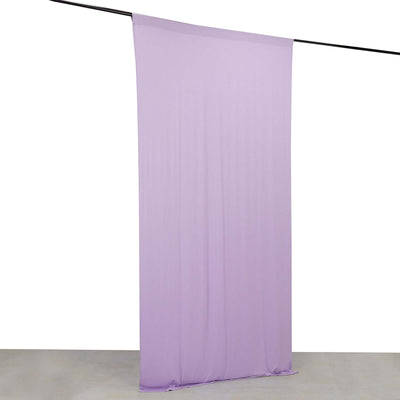 Purple fabric backdrop hanging on a rod for photography or events.