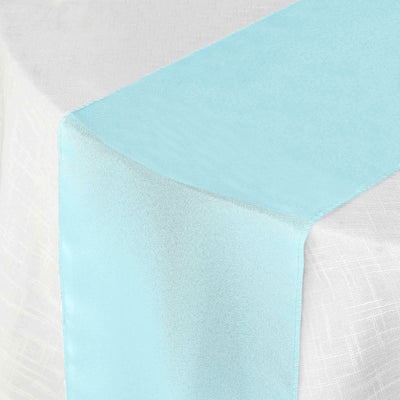 Light blue table runner on a white tablecloth