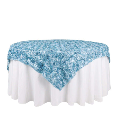 Blue rose patterned tablecloth draped over a round table