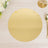 Gold round placemat on a wooden table with cutlery and flowers.