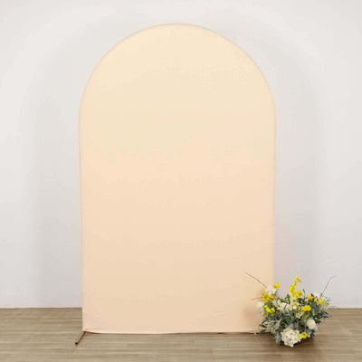 Peach arch backdrop with floral arrangement at the base