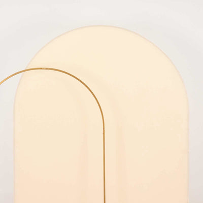 Minimalist arch-shaped decor in soft beige tones.