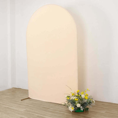 Peach fabric backdrop with floral arrangement in front