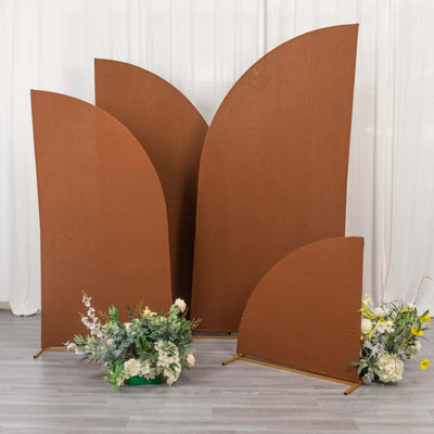 Brown decorative backdrops with floral arrangements in front.
