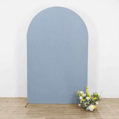 Blue arch backdrop with floral arrangement at the base.