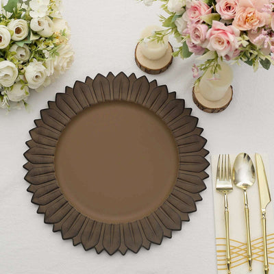 Elegant brown decorative plate with floral edge on a table setting.