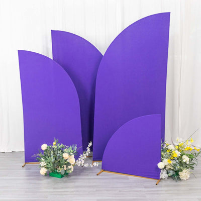 Purple backdrop panels with floral arrangements in front.
