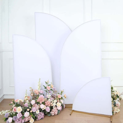 Decorative backdrop with floral arrangement and fabric panels.
