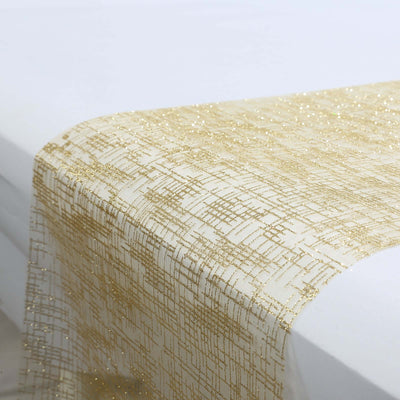 Gold glitter table runner draping elegantly over a white table
