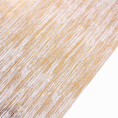 Textured gold and white patterned paper for crafts and designs.
