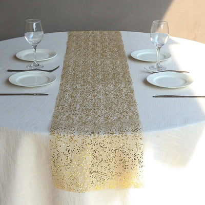 Gold lace table runner on a dining table with plates and glasses.