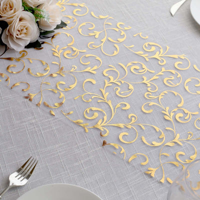 Gold floral lace table runner on a textured tablecloth.