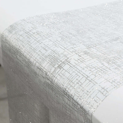 Silver textured table runner on a white table.