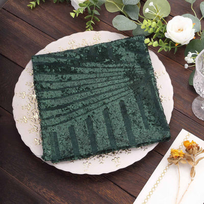 Green sequin table runner on decorative plate with floral accents.