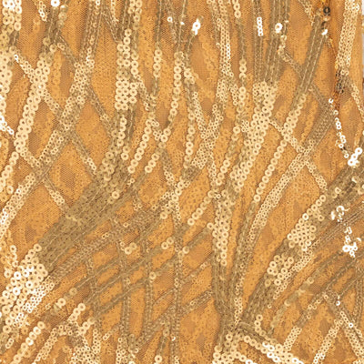 Gold sequin fabric with intricate patterns and textures.