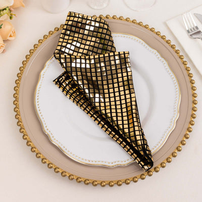 Gold checkered napkin on an elegant plate setting.