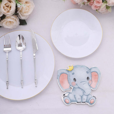 Elephant-themed plate setting with utensils and decorative flowers.