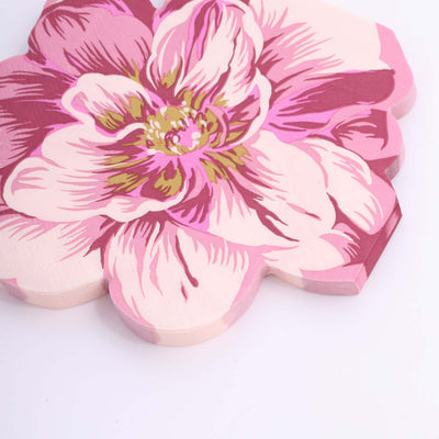 Pink floral-shaped coasters on a white background