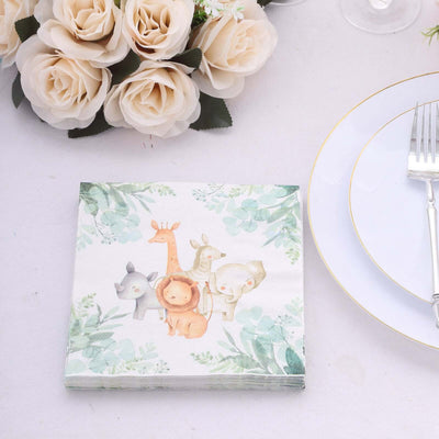 Animal-themed napkins with watercolor design on a table setting.