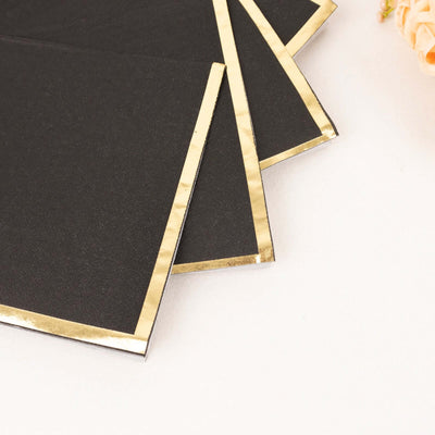 Black envelopes with gold foil edges on a white background.