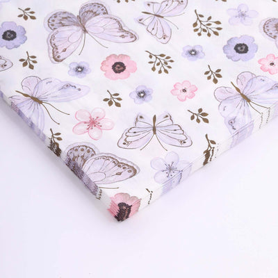 Butterfly and floral patterned wrapping paper on a white background