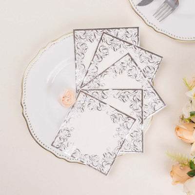 Elegant floral stationery set on a decorative plate.
