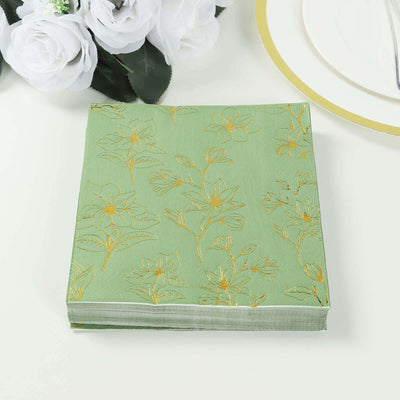 Green floral-patterned notebook with gold accents on a plain background.