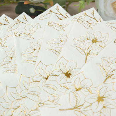 Gold floral patterned napkins on a white background.