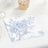 Floral patterned napkin on a table setting with dessert